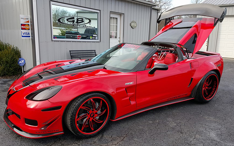 Customized red luxury car by GB Customs & Collision in Corbin, KY